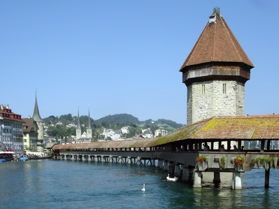 Luzern's Reuss River is spanned by the wooden Chapel Bridge, with its iconic stone water tower.